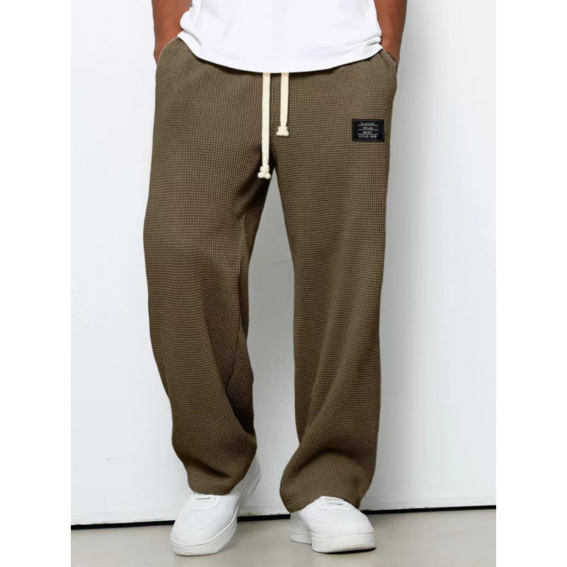 Pantalon décontracté à cordon de serrage en tissu gaufré pour homme