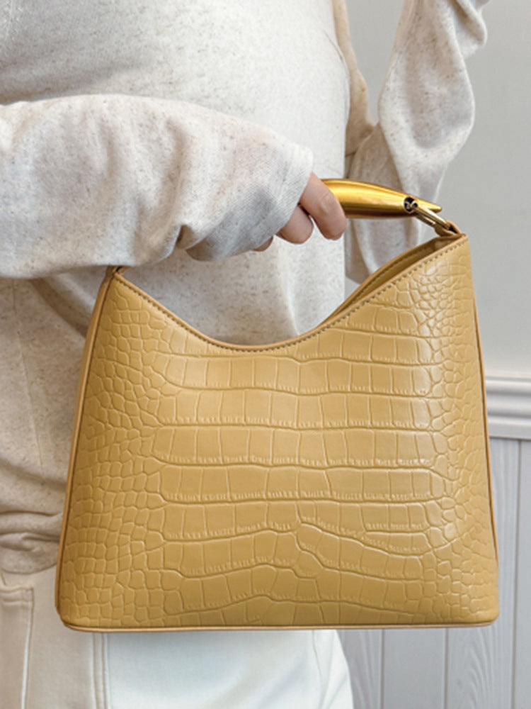 Sac seau à motif crocodile texturé
