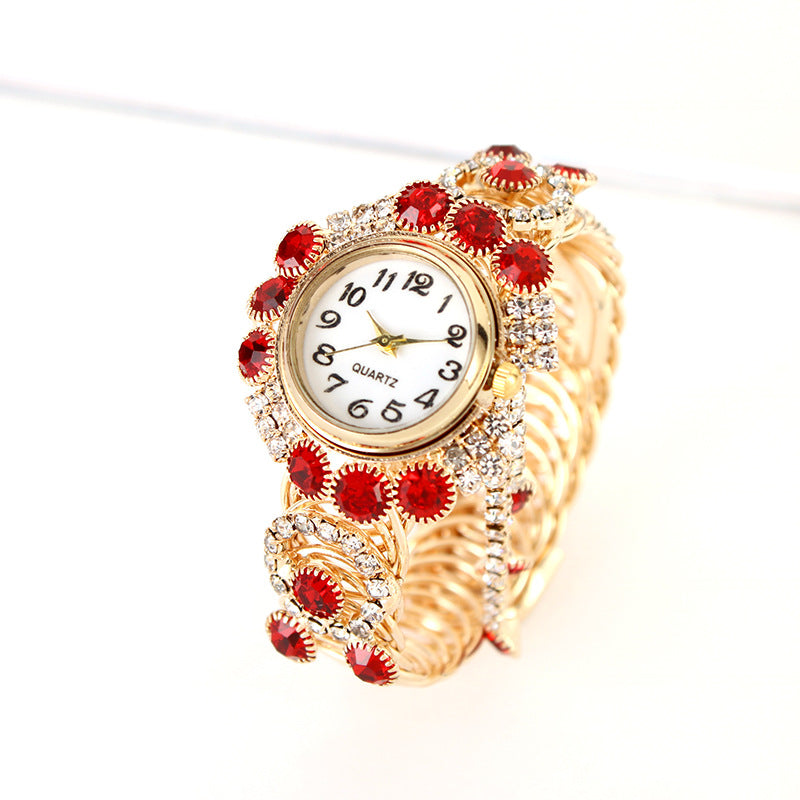 Montre-bracelet pour femmes avec strass et pampille