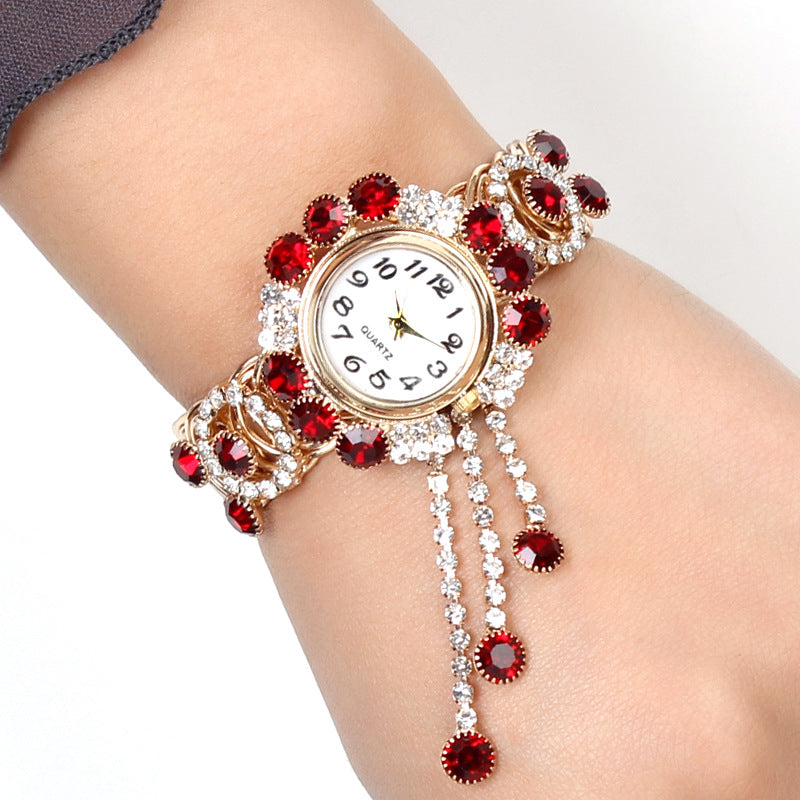 Montre-bracelet pour femmes avec strass et pampille