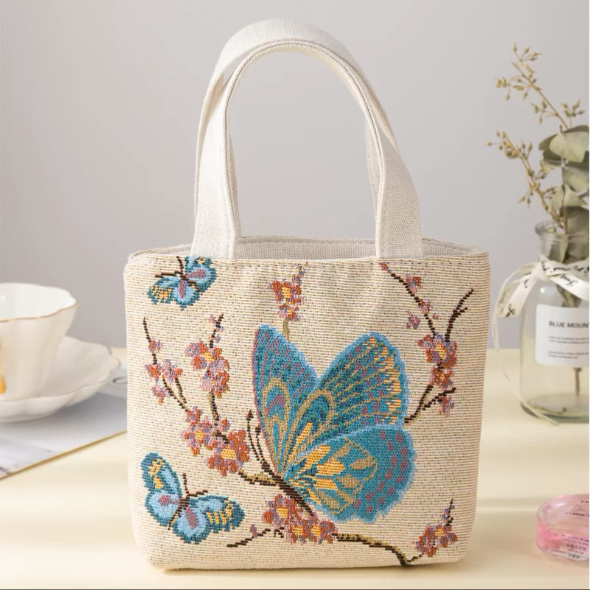 Sac à main en toile brodée double face