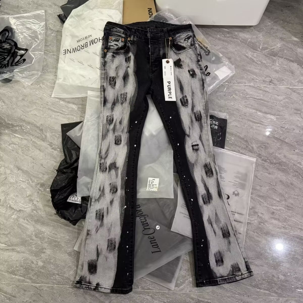 Jean en denim déchiré à patchwork coupe slim pour hommes