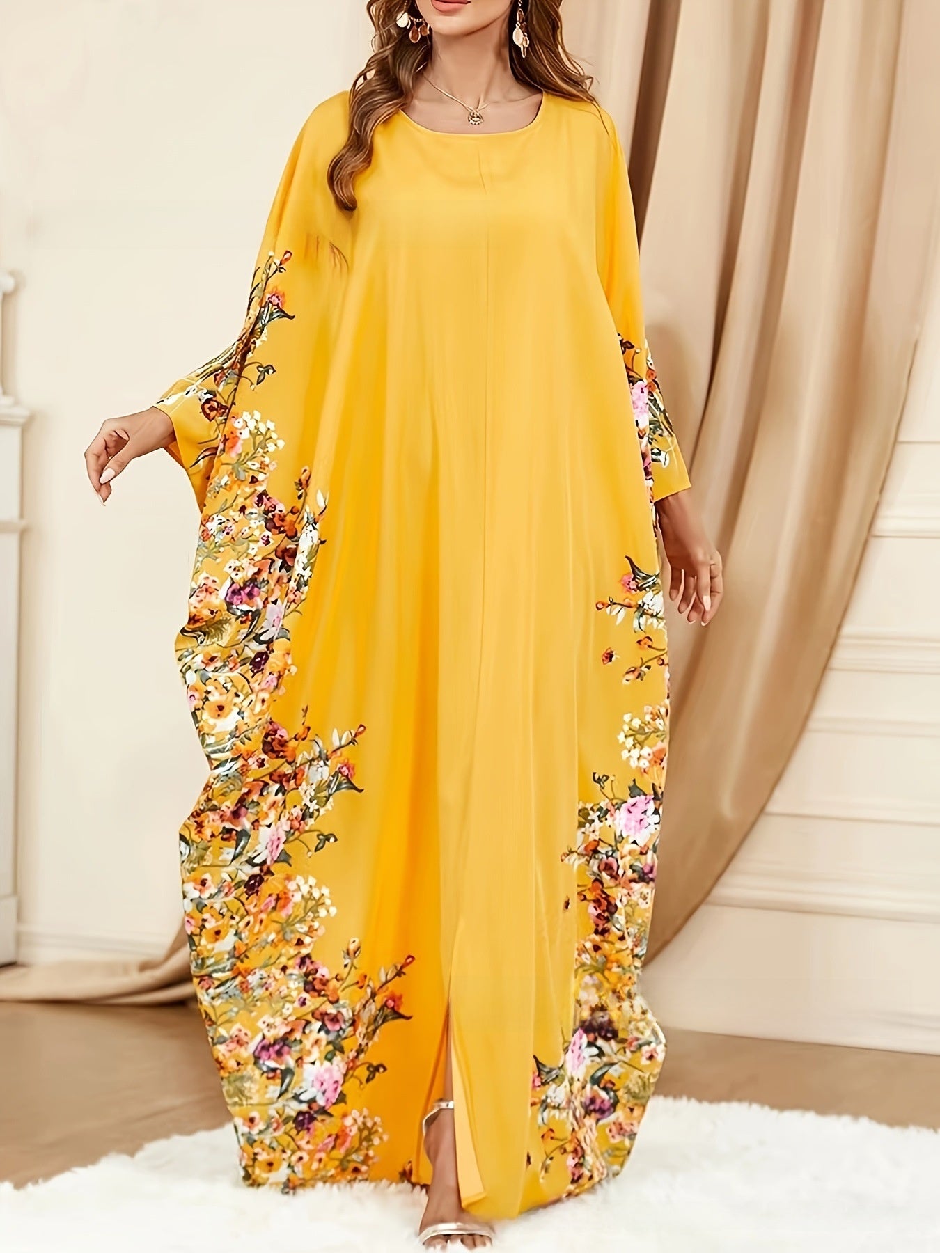 Robe longue élégante à manches chauve-souris