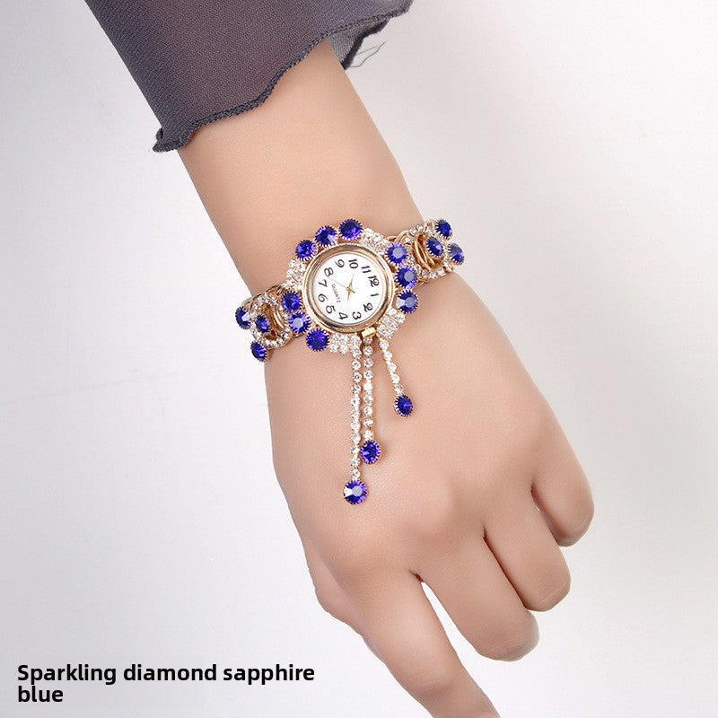 Montre-bracelet pour femmes avec strass et pampille