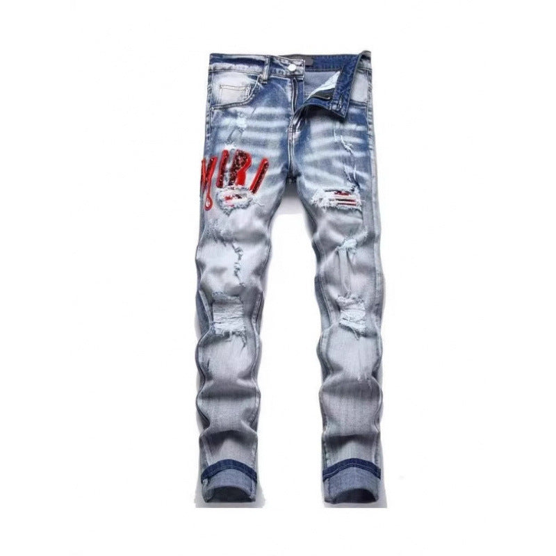 Jean en denim déchiré à patchwork coupe slim pour hommes