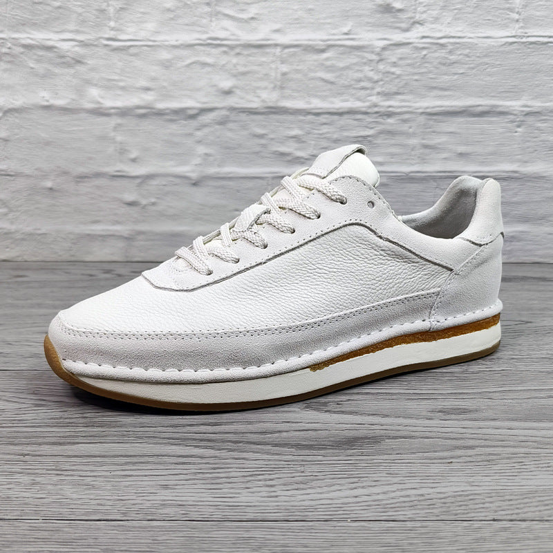 Chaussures décontractées pour hommes en cuir véritable, respirantes et confortables, à semelle plate.