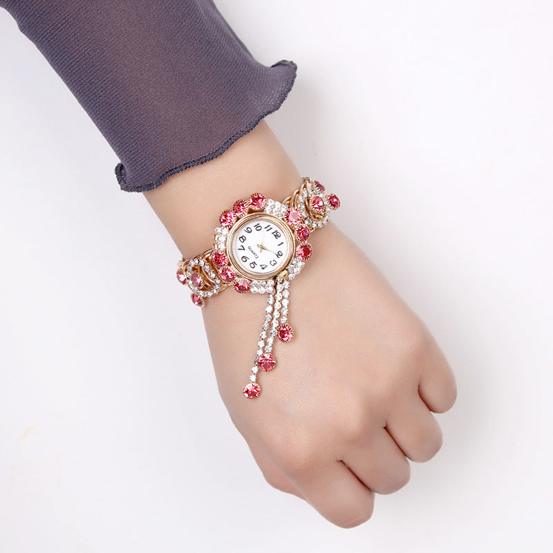 Montre-bracelet pour femmes avec strass et pampille