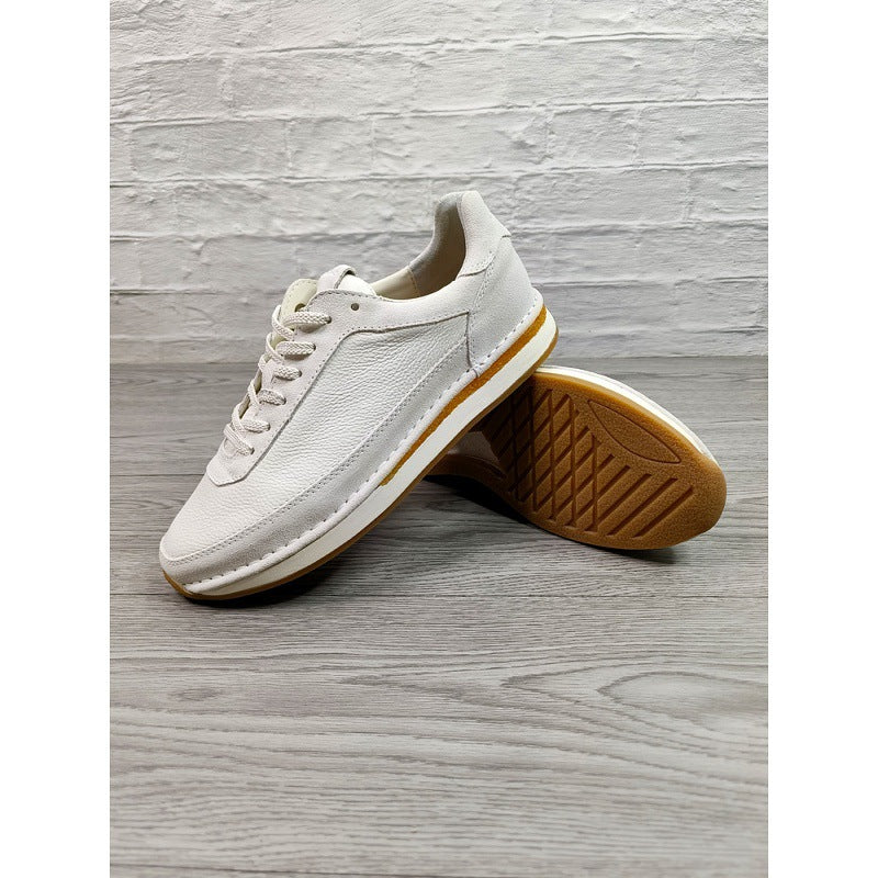Chaussures décontractées pour hommes en cuir véritable, respirantes et confortables, à semelle plate.