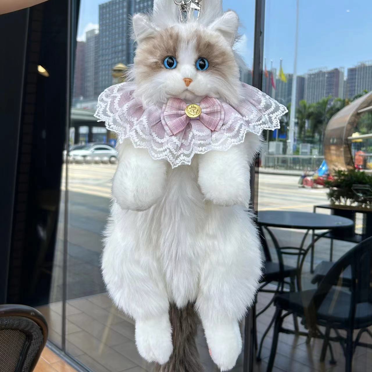 Sac à dos poupée chat en peluche