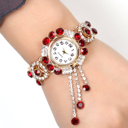 Montre-bracelet pour femmes avec strass et pampille