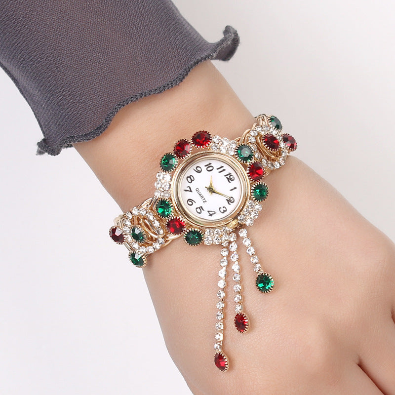 Montre-bracelet pour femmes avec strass et pampille