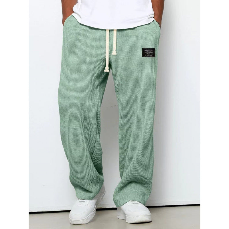 Pantalon décontracté à cordon de serrage en tissu gaufré pour homme
