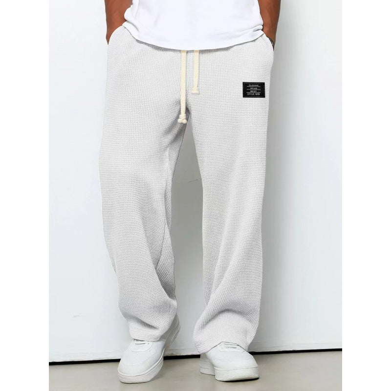 Pantalon décontracté à cordon de serrage en tissu gaufré pour homme