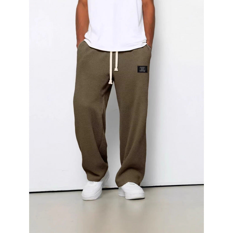 Pantalon décontracté à cordon de serrage en tissu gaufré pour homme