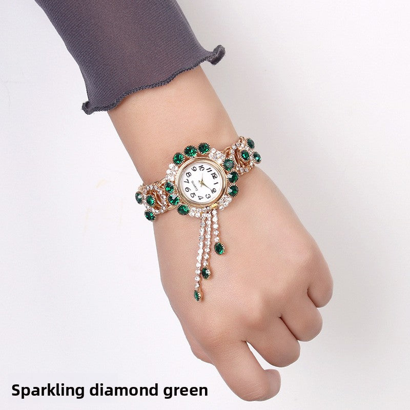 Montre-bracelet pour femmes avec strass et pampille