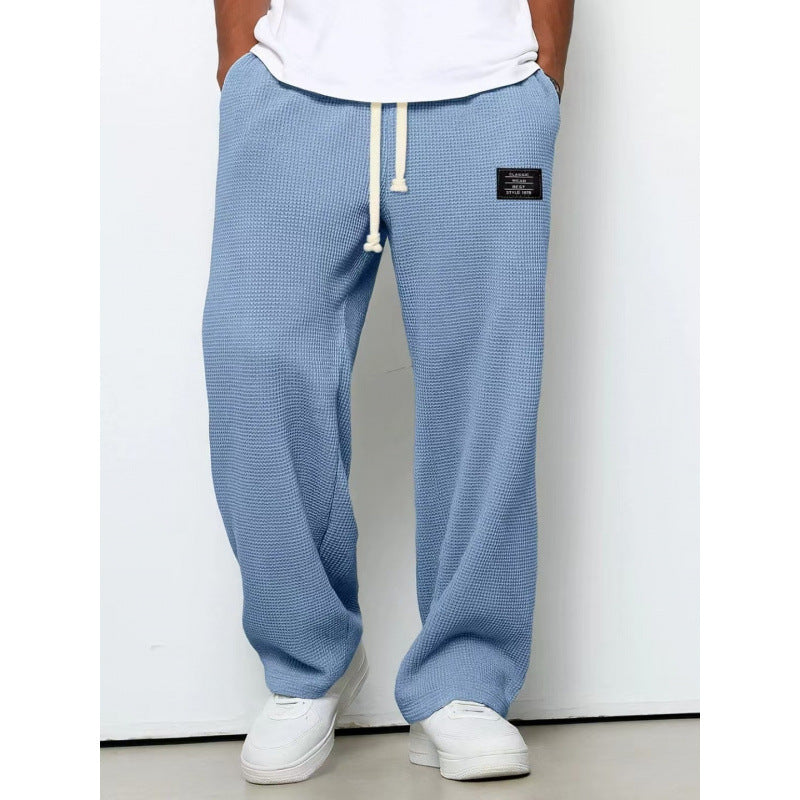Pantalon décontracté à cordon de serrage en tissu gaufré pour homme