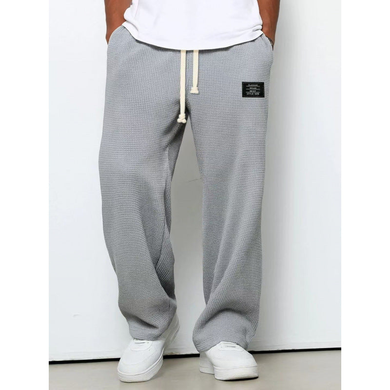Pantalon décontracté à cordon de serrage en tissu gaufré pour homme