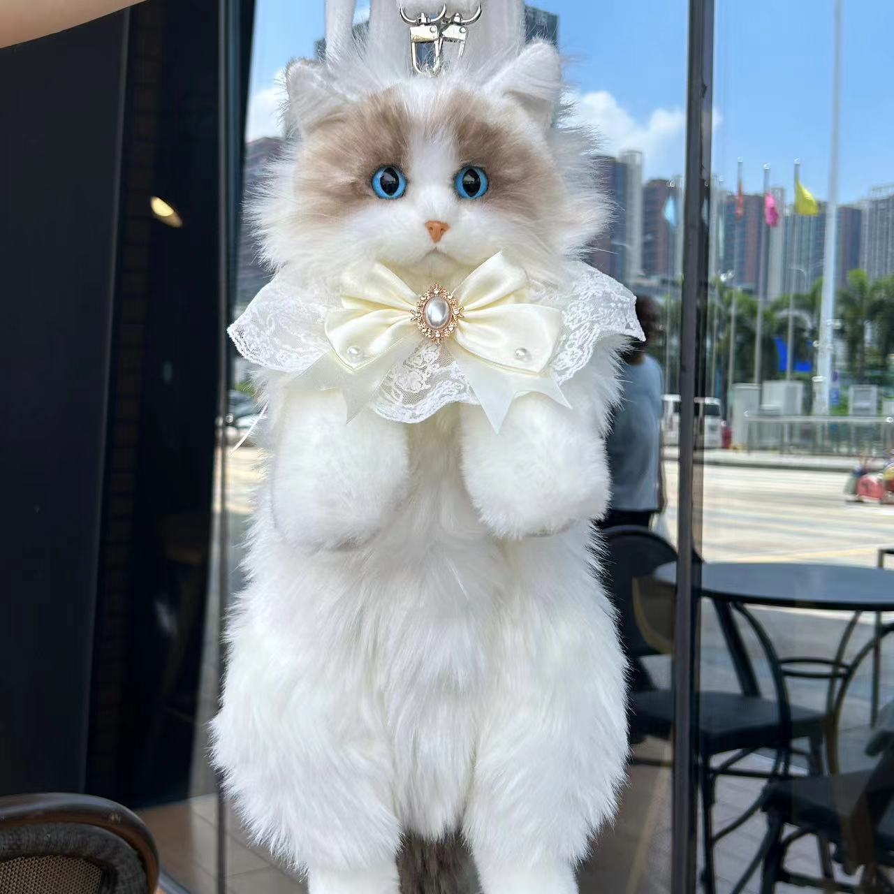 Sac à dos poupée chat en peluche