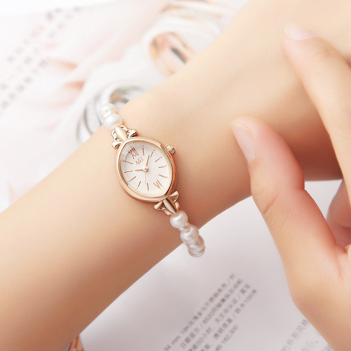 Montre coquillage et perle