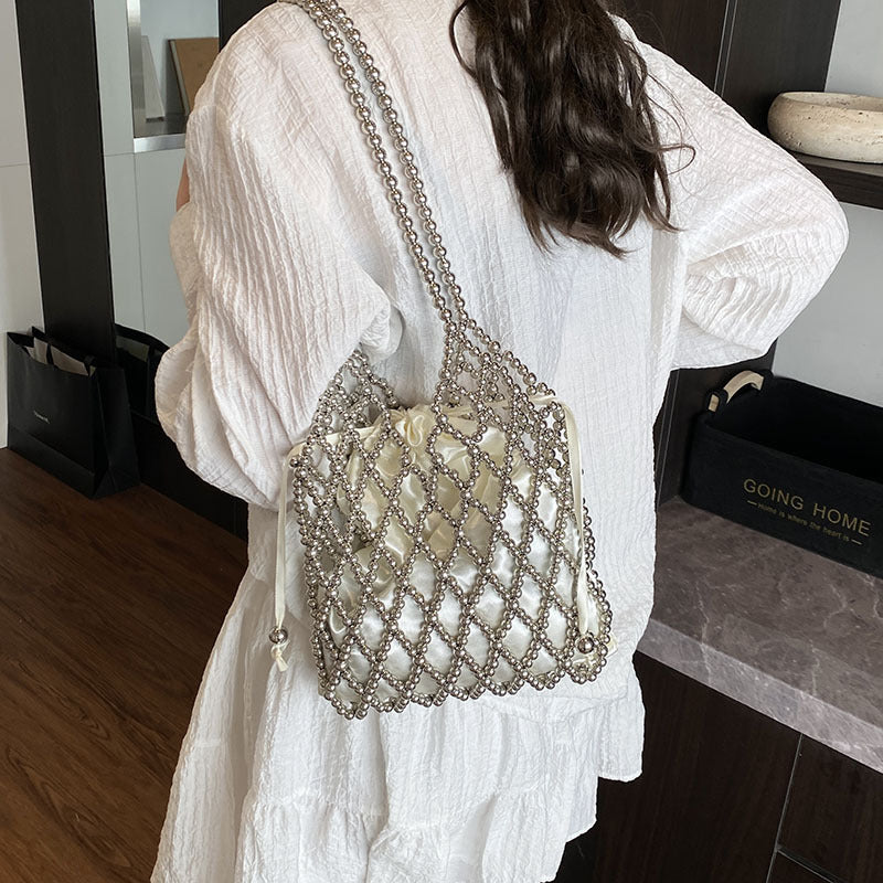 Sac à bandoulière tissé et perlé